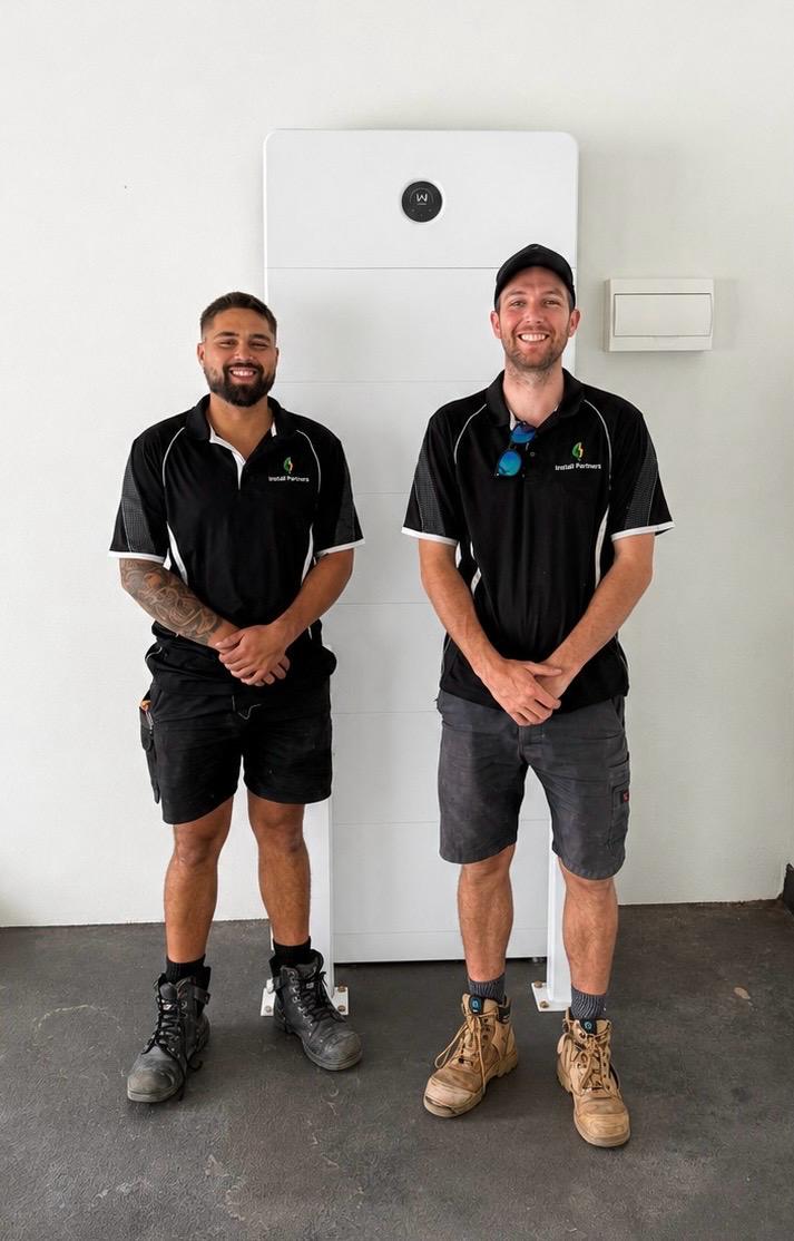 Marcus and Stephen, founders of Install Partners Australia, with a home battery system